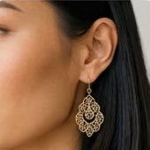 Close detail of an earring on the same customer